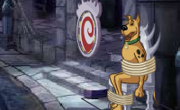 Voer snacks aan Scooby zodat hij sterker worden en zo bevrijd kan worden.