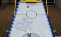 Jogue uma partida de Air Hockey contra o computador.